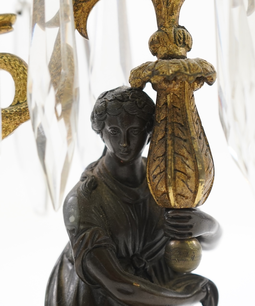 After Mathurin Moreau. A pair of mid 19th century bronze and gilt bronze two branch candelabra